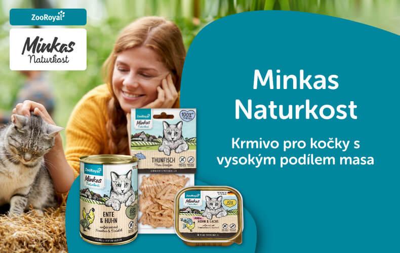 ZooRoyal Minkas Naturkost pro kočky Banner s kočkou sedící na slámě vedle osoby a sady produktů Minkas Naturkost pro kočky.