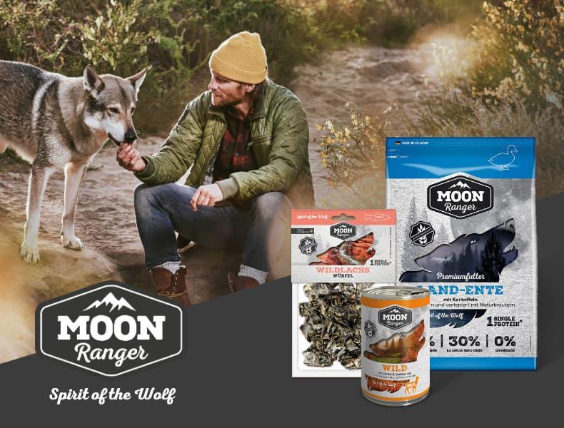 MOON Ranger pro psy Banner s osobou krmící psa a sadou produktů MOON Ranger pro psy.